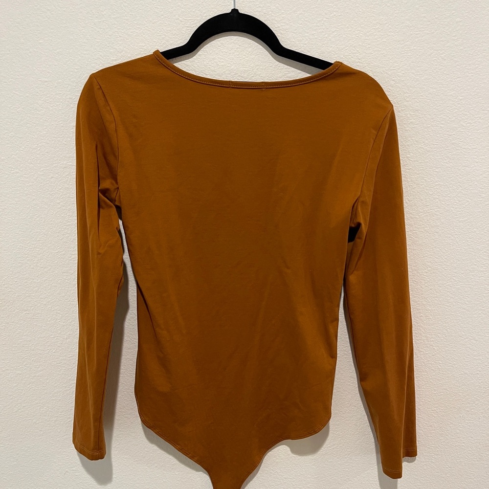 Rust orange body suit